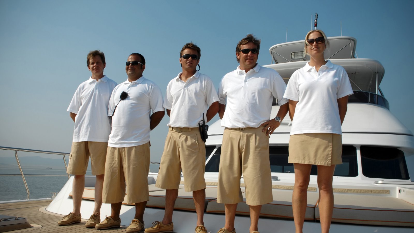 Yacht crew group on a superyacht deck